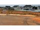 Street view showcasing the neighborhood homes and available home site with visible signage at 56 Braddock Ct, Garner, NC 27529