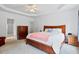 Spacious main bedroom features a tray ceiling, and neutral color scheme at 5608 Scottish Hills Dr, Holly Springs, NC 27540