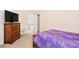 Bedroom featuring a dresser with a television at 5608 Scottish Hills Dr, Holly Springs, NC 27540