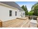A well-maintained wooden deck featuring space for seating, enhancing the outdoor living experience of the home at 5608 Scottish Hills Dr, Holly Springs, NC 27540
