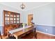 Elegant dining room featuring a large wooden hutch, perfect for hosting dinner parties at 5608 Scottish Hills Dr, Holly Springs, NC 27540