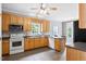 Well-lit kitchen equipped with stainless steel appliances and ample counter space at 5608 Scottish Hills Dr, Holly Springs, NC 27540