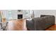 Cozy living room featuring a fireplace, hardwood floors, and comfortable seating at 5608 Scottish Hills Dr, Holly Springs, NC 27540