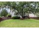 Expansive backyard with lush green lawn and mature trees at 5637 Yates Garden Ln, Raleigh, NC 27606