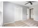Clean bedroom featuring a ceiling fan and closet at 5637 Yates Garden Ln, Raleigh, NC 27606