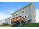 Exterior view of a multi-story home with a wooden deck in the backyard at 6101 Ricker Rd, Raleigh, NC 27610