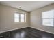 Bedroom featuring multiple windows for natural light and wood-look floors at 6101 Ricker Rd, Raleigh, NC 27610