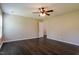 Bright bedroom features a ceiling fan, wood-look floors, and neutral paint at 6101 Ricker Rd, Raleigh, NC 27610
