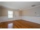 Entryway with hardwood floors, white wainscoting, and a front door providing ample natural light at 6101 Ricker Rd, Raleigh, NC 27610
