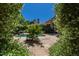 Beautiful backyard showcasing the pool, meticulous landscaping, and a view of the estate's elegant architecture at 6510 New Market Way, Raleigh, NC 27615