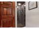 Luxurious bathroom with marble shower and wooden door at 6510 New Market Way, Raleigh, NC 27615