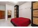 Modern bedroom featuring a platform bed, custom cabinetry, and ensuite bathroom at 6510 New Market Way, Raleigh, NC 27615