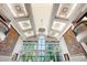 Cathedral ceiling with recessed lighting, windows, and tapestries offers architectural grandeur at 6510 New Market Way, Raleigh, NC 27615