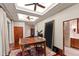 A well-lit dining room featuring a wooden table, colorful chairs, hardwood floors, and recessed ceiling lights at 6510 New Market Way, Raleigh, NC 27615
