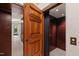 This home features a private residential elevator with rich wood paneling and easy access at 6510 New Market Way, Raleigh, NC 27615
