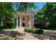 Elegant home with a stately facade, circular driveway, and well-maintained garden at 6510 New Market Way, Raleigh, NC 27615