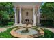 Grand entrance featuring stately columns and a beautiful fountain in the foreground at 6510 New Market Way, Raleigh, NC 27615