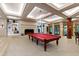 Elegant game room featuring a billiards table, fireplace, and custom lighting at 6510 New Market Way, Raleigh, NC 27615