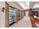 Spacious hallway with stone accent wall and large windows providing ample natural light at 6510 New Market Way, Raleigh, NC 27615