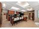 Gourmet kitchen featuring granite countertops, wine cooler, stainless appliances, and a stone fireplace at 6510 New Market Way, Raleigh, NC 27615
