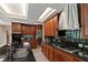 Gourmet kitchen featuring an island with sink, granite countertops, and stainless steel appliances at 6510 New Market Way, Raleigh, NC 27615