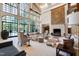 Spacious living area with tall windows, stylish seating, and unique decor showcases sophisticated design at 6510 New Market Way, Raleigh, NC 27615
