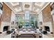 Bright living room with high ceilings, a wall of windows, and elegant decor at 6510 New Market Way, Raleigh, NC 27615