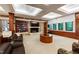 Comfortable living room with a fireplace, stone accent wall, and built-in bookcase at 6510 New Market Way, Raleigh, NC 27615