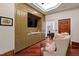 Stylish living room area with custom cabinetry, built-in wet bar, and comfortable seating at 6510 New Market Way, Raleigh, NC 27615