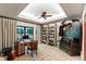 Study with patterned rug, a ceiling fan, and an antique black secretary desk at 6510 New Market Way, Raleigh, NC 27615
