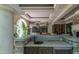 Outdoor bar area featuring stone accents, a sink, and storage, perfect for entertaining guests at 6510 New Market Way, Raleigh, NC 27615
