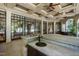 Entertainer's dream with an outdoor kitchen, wet bar and seamless indoor-outdoor flow through expansive glass doors at 6510 New Market Way, Raleigh, NC 27615