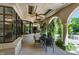 Inviting covered patio with climbing greenery, features an outdoor dining set, perfect for relaxed entertaining at 6510 New Market Way, Raleigh, NC 27615