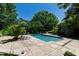 Inviting backyard pool with sun loungers surrounded by lush landscaping at 6510 New Market Way, Raleigh, NC 27615