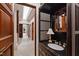 Powder room featuring a vanity with decorative mirror and marble countertop at 6510 New Market Way, Raleigh, NC 27615