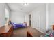 bedroom featuring two twin beds, a dresser and neutral paint at 68 Holly Berry Ln, Durham, NC 27703