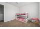 bedroom featuring a bunk bed and a window at 68 Holly Berry Ln, Durham, NC 27703