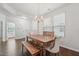 Bright dining room features a rustic wood table set and elegant chandelier lighting at 68 Holly Berry Ln, Durham, NC 27703