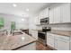 Modern kitchen featuring stainless steel appliances and granite countertops at 68 Holly Berry Ln, Durham, NC 27703