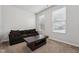 Living room with a comfortable couch and coffee table, complemented by natural light at 68 Holly Berry Ln, Durham, NC 27703