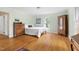 Bedroom featuring hardwood floors, with traditional furnishings and light green walls at 816 Miller Rd, Hillsborough, NC 27278