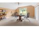 Bonus room with a game table, ceiling fan, and window with backyard views at 816 Miller Rd, Hillsborough, NC 27278