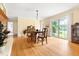 Sunlit dining area with hardwood floors, leading to an outdoor patio at 816 Miller Rd, Hillsborough, NC 27278