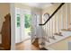 Inviting foyer with hardwood floors and a staircase leading to the upper level at 816 Miller Rd, Hillsborough, NC 27278