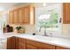 Close up of kitchen showing sink, faucet and white countertop and oak cabinets at 816 Miller Rd, Hillsborough, NC 27278