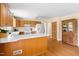 Open kitchen featuring wood cabinets, stainless appliances and breakfast bar at 816 Miller Rd, Hillsborough, NC 27278