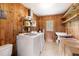 Functional laundry room with washer, dryer, utility sink, and ample storage space at 816 Miller Rd, Hillsborough, NC 27278