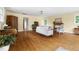 Open concept living room offers ample seating, hardwood floors, and natural light at 816 Miller Rd, Hillsborough, NC 27278