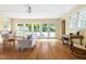 Bright living room with hardwood floors, large windows, and ample natural light at 816 Miller Rd, Hillsborough, NC 27278