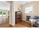 Bright living room featuring hardwood floors, built in bookcase and comfortable seating at 816 Miller Rd, Hillsborough, NC 27278